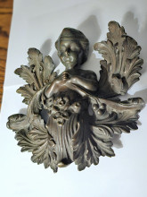 Bronze cupid with vacant leaves 