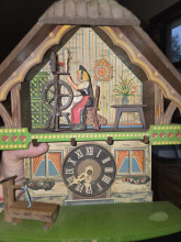 Vintage Cuckoo Clock with Spinning Wheel Scene — valued $150–$250