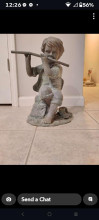 Child Playing Flute Sculpture